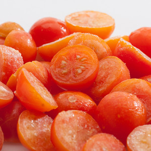 Deep red cherry tomatoes slices